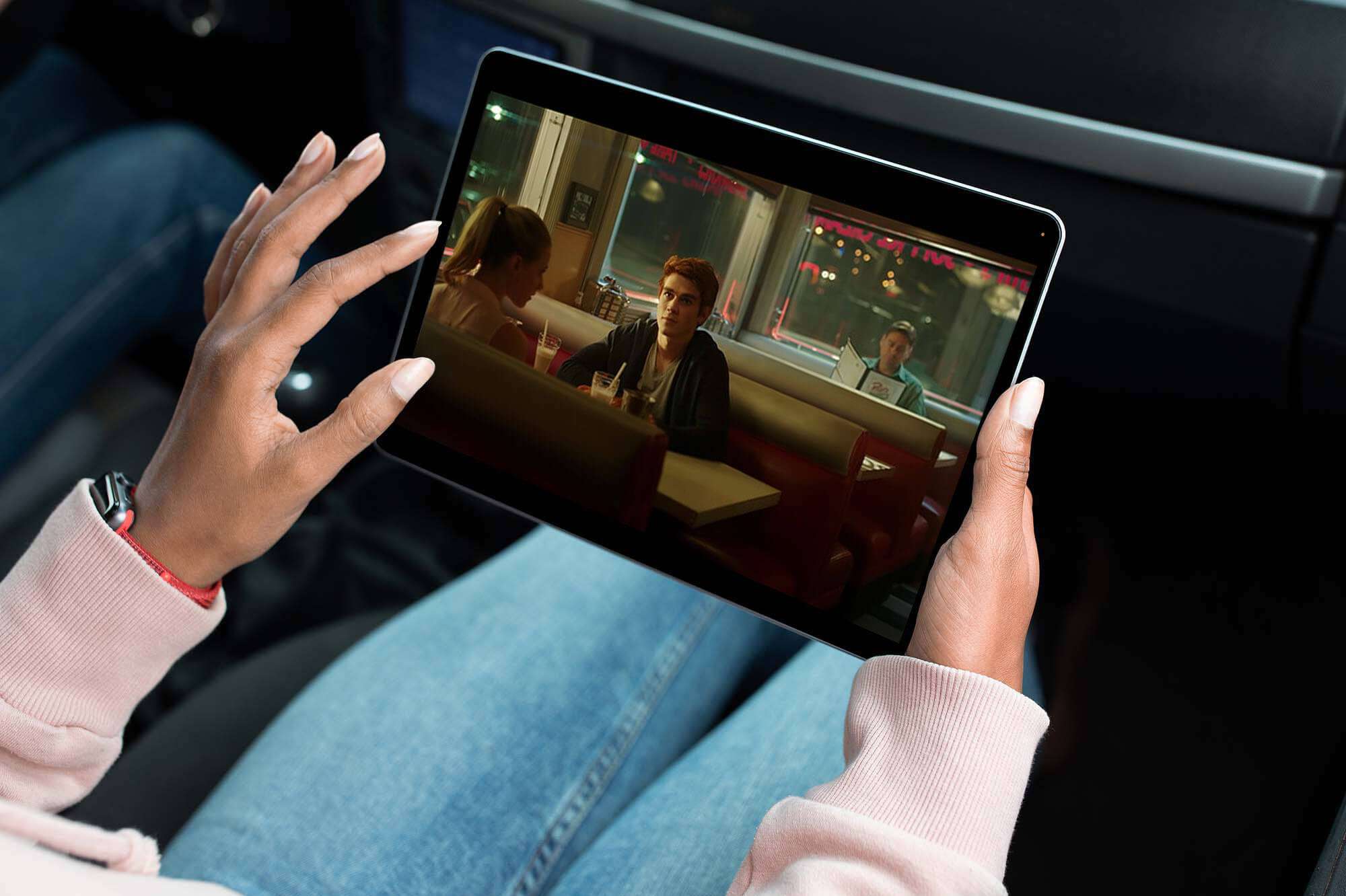 Woman watching Riverdale on a tablet