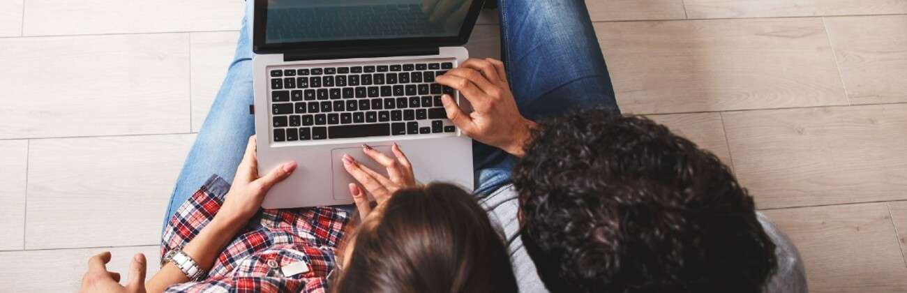 Seated couple create an account online