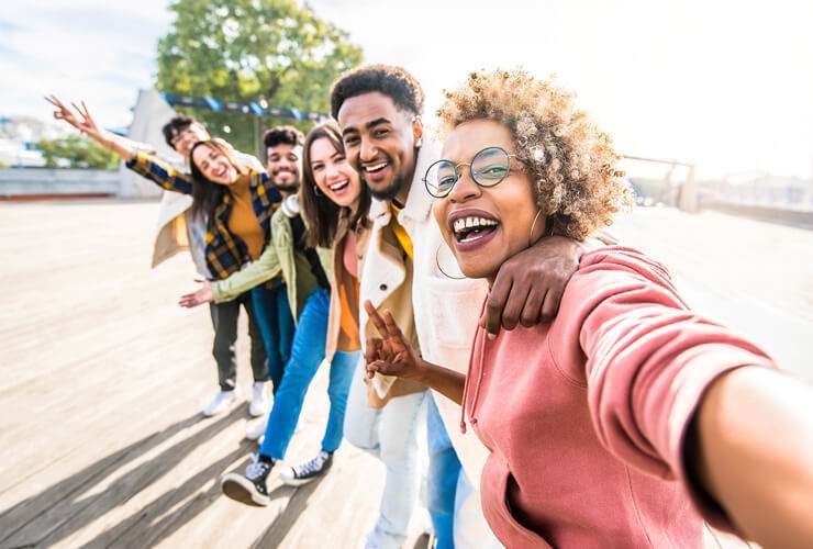 Group selfie with multiracial friend group