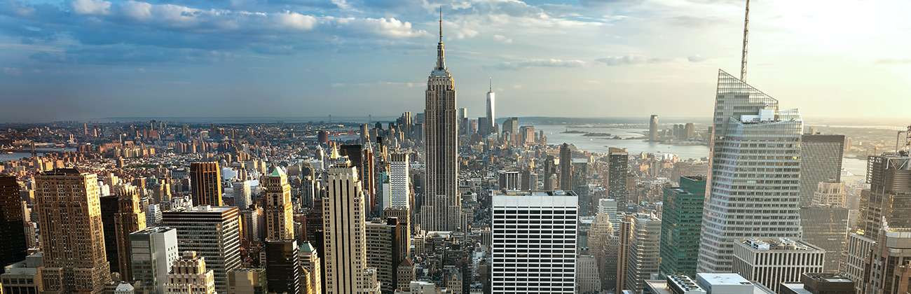 City overview shows densely packed tall buildings