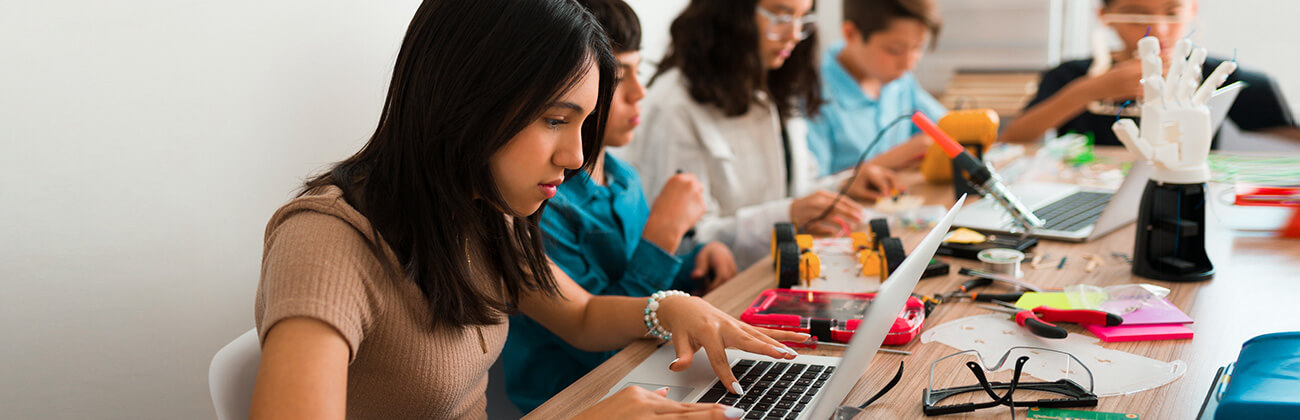 A group of teens learning from home illustrate some of the factors to consider when deciding if you need 600 Mbps internet.